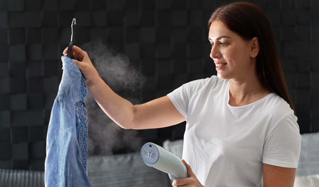 Remove wrinkles from dry clean only clothes using a steamer