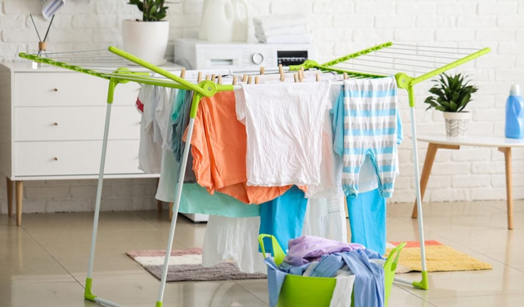 Line drying clothes indoors during rain